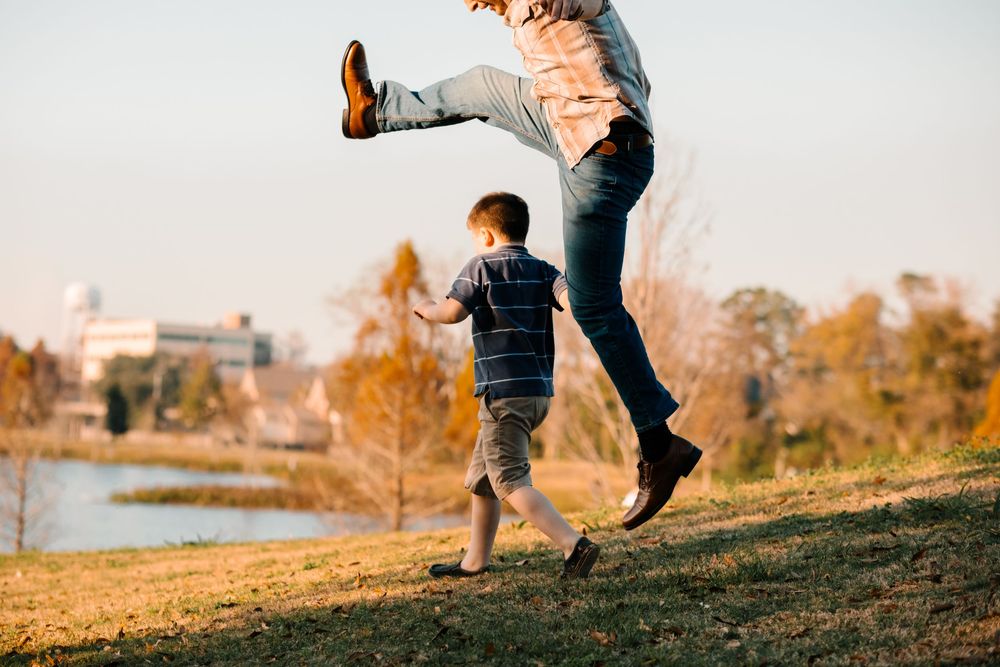 Parent and child playing together outdoors in Lafayette