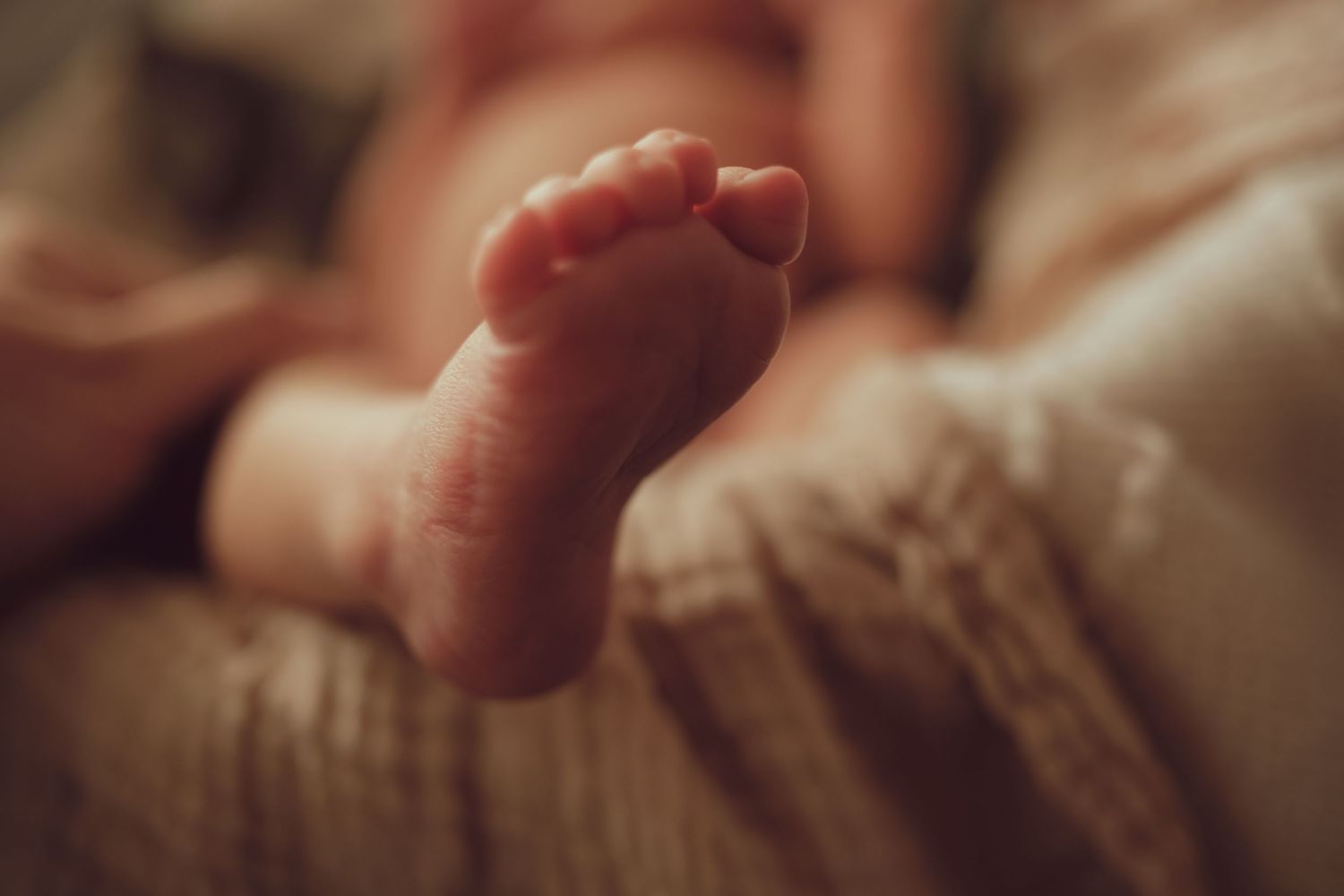 Close detail of a newborn baby's foot photographed at home in Lafayette