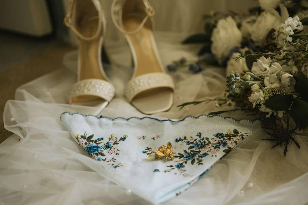 Wedding rings arranged with an invitation suite and lace details