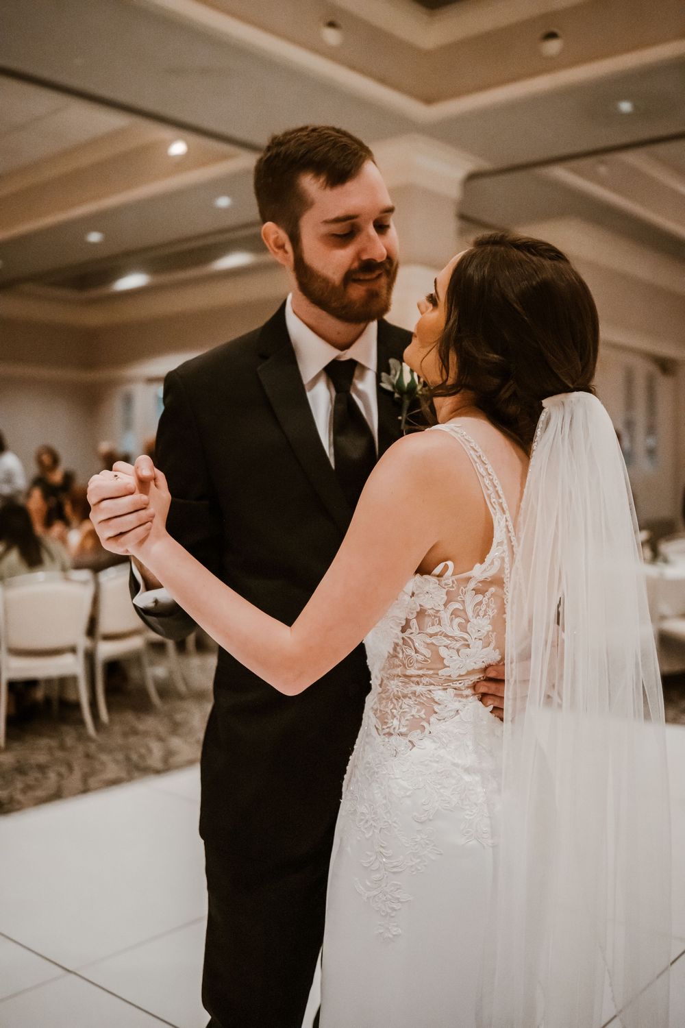 Bride and groom dancing together during their wedding reception